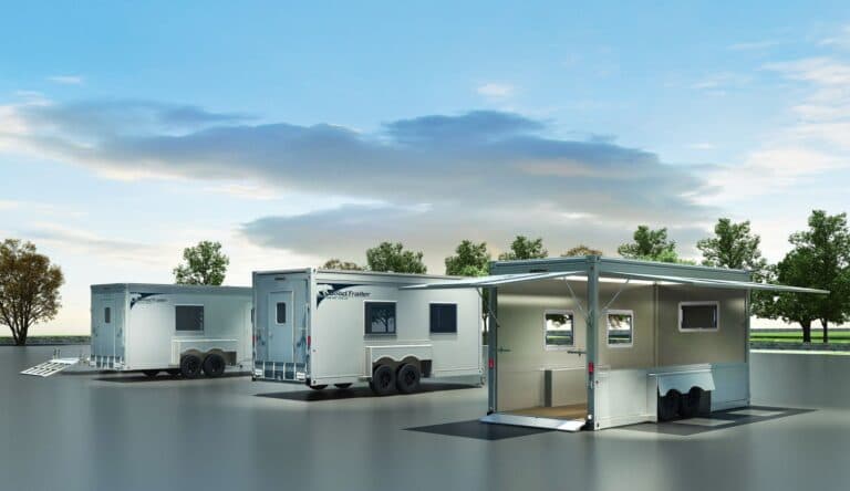 Three Good Trailers, one with two flat panels open, with lowered ramp.
