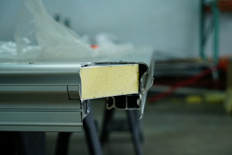 A composite aluminum panel cut away to show the foam inside.