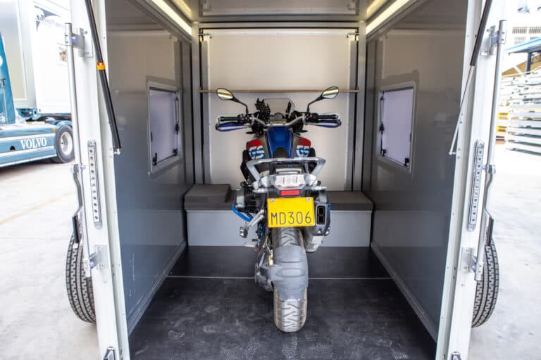 A motorcycle tucked neatly into a lockable GT09AL trailer.