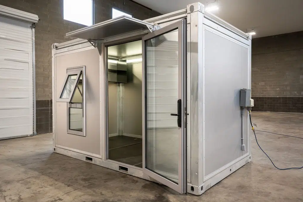 Rapid Deployment Modular Structure - 13' modular office building plugged into the wall.