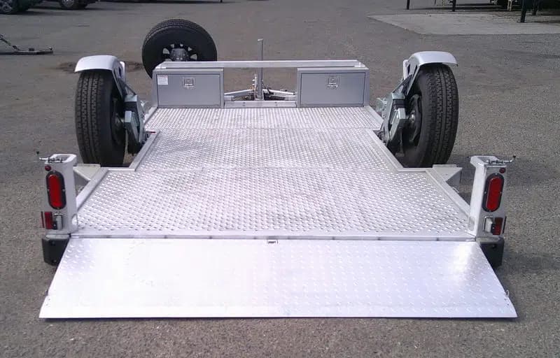 Skid Steer Trailer - GT19FL drop deck on the ground with the ramp down.
