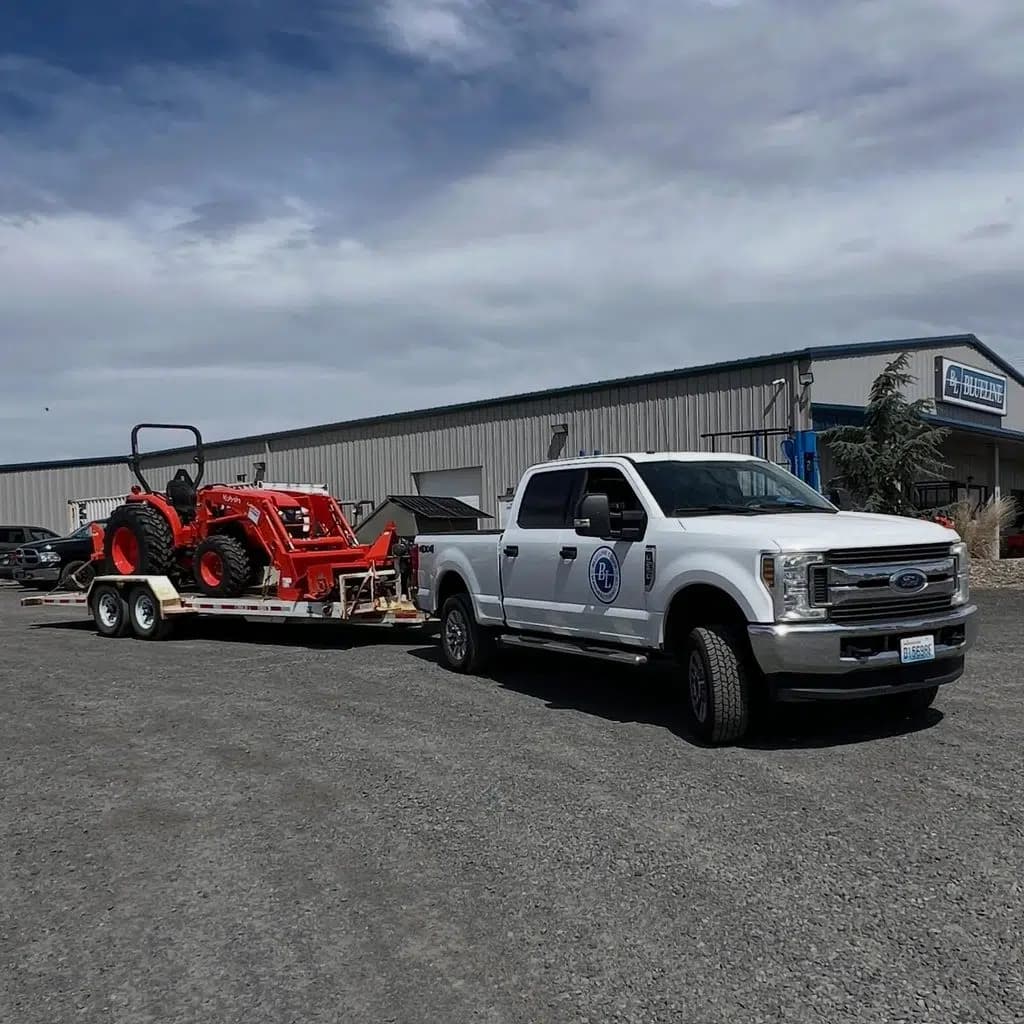 Prevent Breaking Equipment by Hauling Better - Kubota Tractor on GT13FL - Blueline Equipment Rental