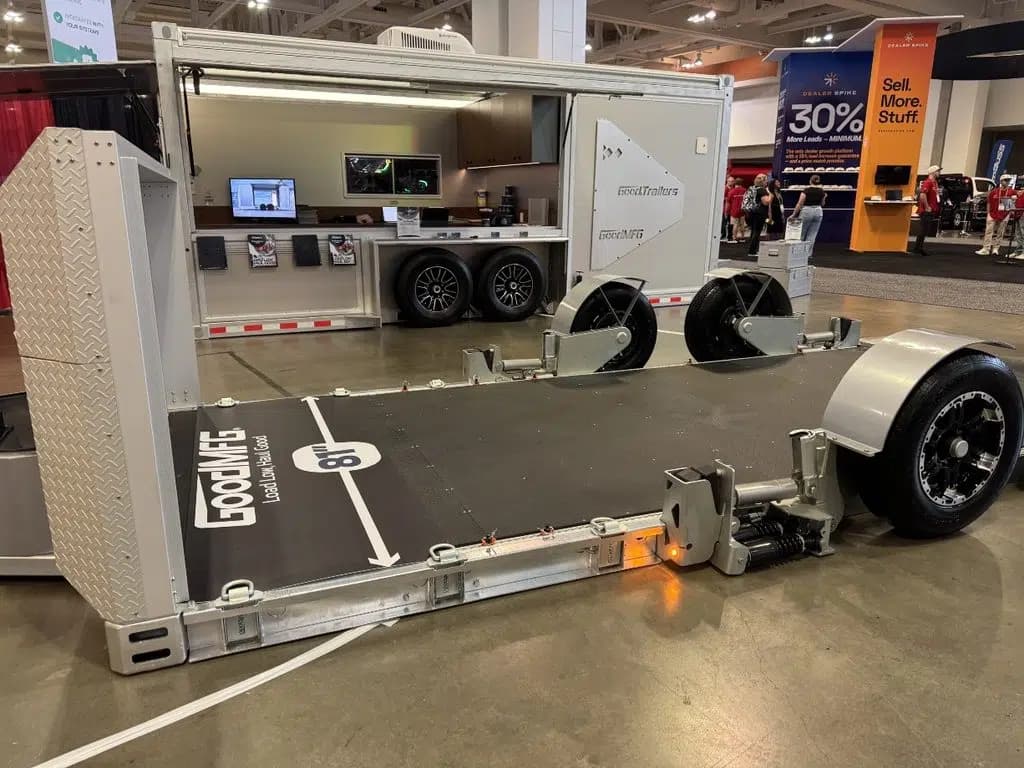 Mobile Farm Office - The Office trailer with monitors and a coffee station inside, at trade show with GT DriveGlide flatbed car hauler prototype.