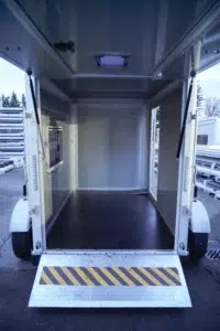 Interior of one of our 9ft Aluminum Cargo Trailers with open flip panel and lowered ramp, ready for easy loading.